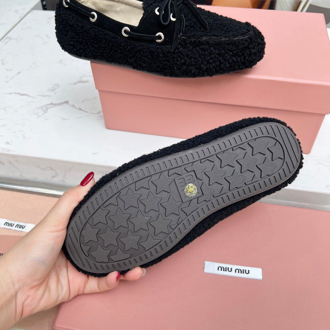 MIUMIU 26S BOAT LOAFERS IN BLACK SHEARLING