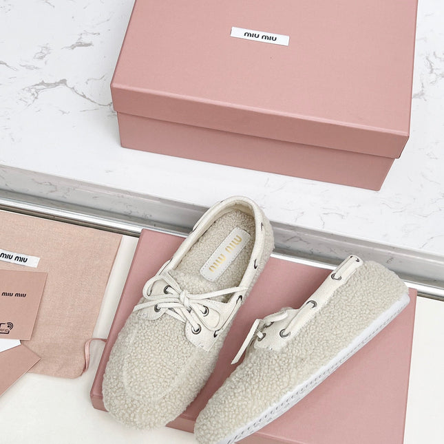 MIUMIU 26S BOAT LOAFERS IN BEIGE SHEARLING