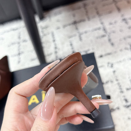 ALAIA 26S HEELED MULES 65 MM IN CHOCOLATE BROWN SATIN