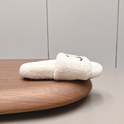 CHANEL 26S SLIDE MULES IN WHITE SHEARLING AND BLACK CC LOGO