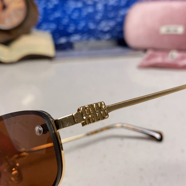 MIUMIU 26S RECTANGULAR FRAME IN METAL 426398