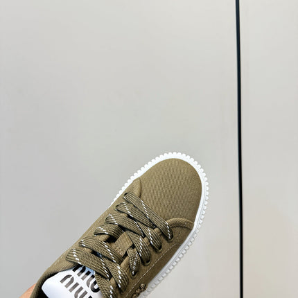 MIUMIU 26S SNEAKER MULES IN OLIVE GREEN CANVAS