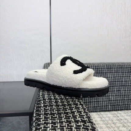 CHANEL 26S SLIDE SANDALS  IN BLACK AND WHITE SHEARLING