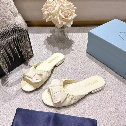 PRADA 26S RUCHED BOW SLIDE SANDALS IN IVORY WHITE CALFSKIN