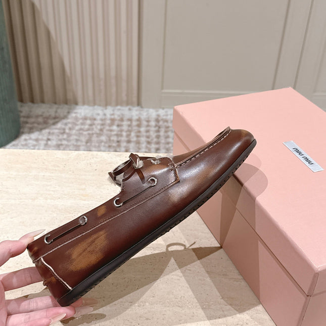 MIUMIU 25S BOAT SHOES IN SIENNA BROWN BLEACHED CALFSKIN WITH SHEARLING