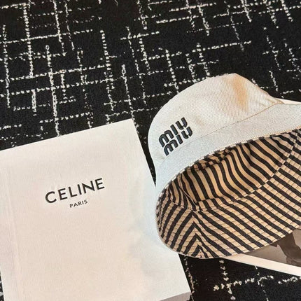 MIUMIU CLASSIC REVERSIBLE BUCKET HAT IN LIGHT BEIGE AND BLACK FABRIC