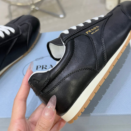 PRADA 26S LACE UP SNEAKERS IN BLACK CALFSKIN