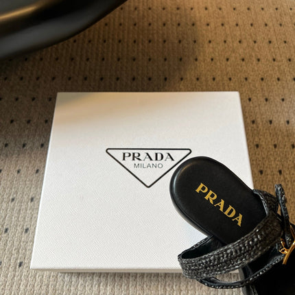 PRADA 26S BLOCK HEEL SANDALS 85MM IN BLACK RAFFIA AND CALFSKIN