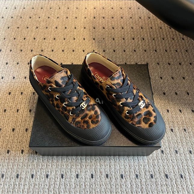 CHANEL 26S LACE UP SNEAKERS IN BLACK CALFSKIN AND BROWN PONY HAIR LEOPARD PRINT