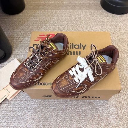 MIUMIU 26S PERFORATED SNEAKERS IN DARK BROWN CALFSKIN