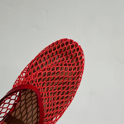 ALAIA FLAT MULES IN CHERRY RED MESH FISHNET