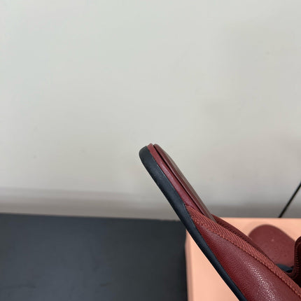 BOW MULES IN RED BROWN SHEEPSKIN