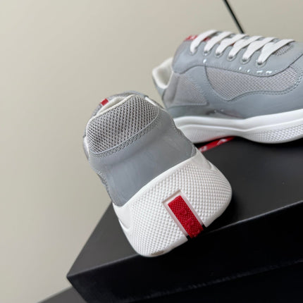 PRADA 26S SNEAKERS IN LIGHT GRAY PATENT CALFSKIN AND WHITE MESH
