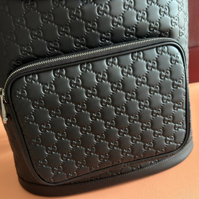 GUCCI 26S GG EMBLEM BACKPACK 44 IN BLACK EMBOSSED CALFSKIN