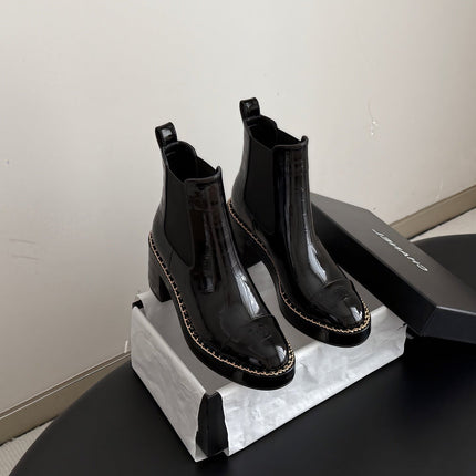 CHANEL 26S CHELSEA ANKLE BOOTS 70 MM IN BLACK EMBOSSED AND PATENT