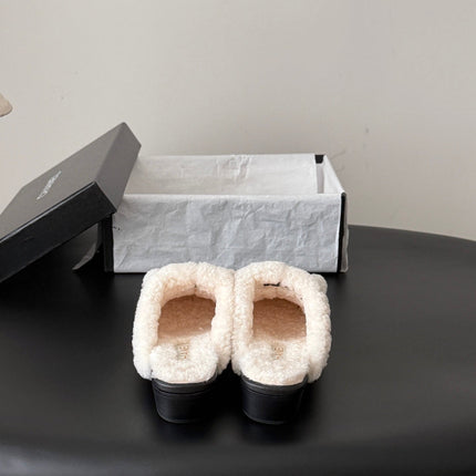 CHANEL 26S MULES IN BLACK SHEARLING AND CALFSKIN