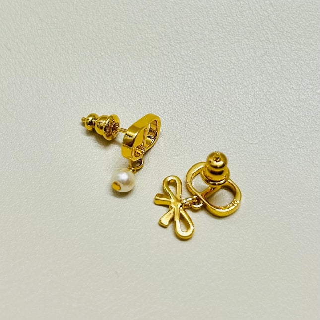 CD 26S MINI BOW PEARL DROP EARRINGS IN GOLD TONE METAL 646612