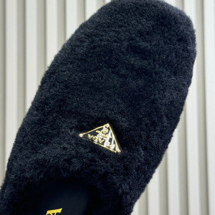 PRADA 25S CLOGS IN BLACK SHEARLING