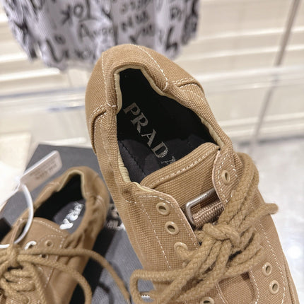 PRADA 26S COLLAPSE SNEAKERS IN BROWN CANVAS